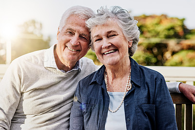 Buy stock photo Senior couple, portrait and relaxing together outdoors or romantic retirement and park bench. Elderly, partners and affectionate faces or in love or date and feeling care or happy outside garden 