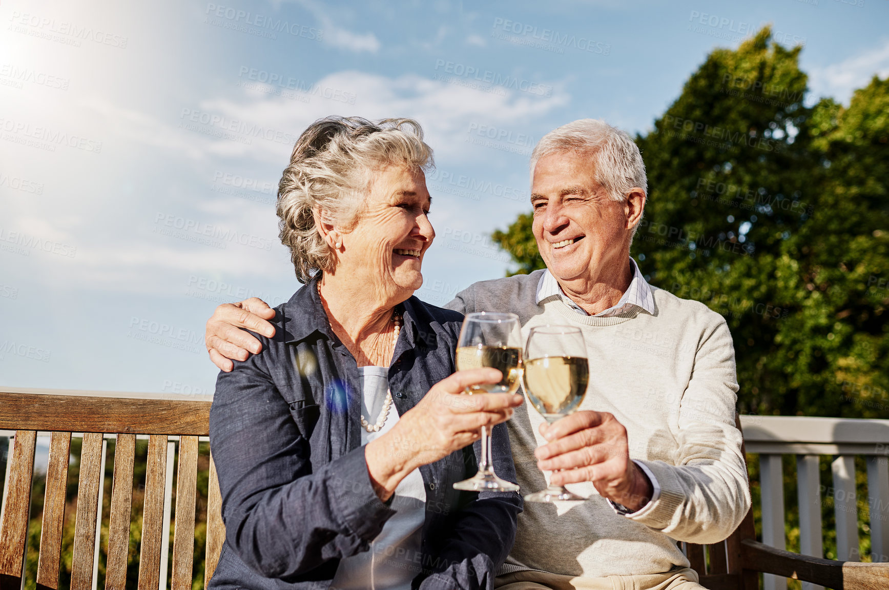Buy stock photo Love, cheers and wine glass, old couple in summer to celebrate romance or anniversary on patio of vacation home. Happiness, senior man and woman with champagne toast, smile and romantic on holiday.