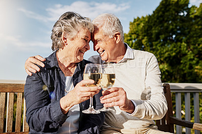 Buy stock photo Love, cheers and happiness, old couple with wine glass to celebrate anniversary on patio of vacation home. Romance, senior man and woman in embrace with champagne toast, smile and romantic holiday.