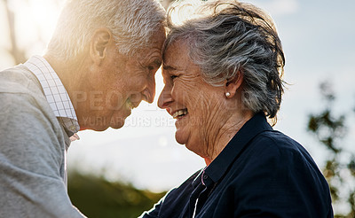 Buy stock photo Love, nature and senior couple intimate or face together and  outdoors or happy in retirement. Mature, man and woman forehead smile in vacation or senior citizens care and  embrace date at the park. 