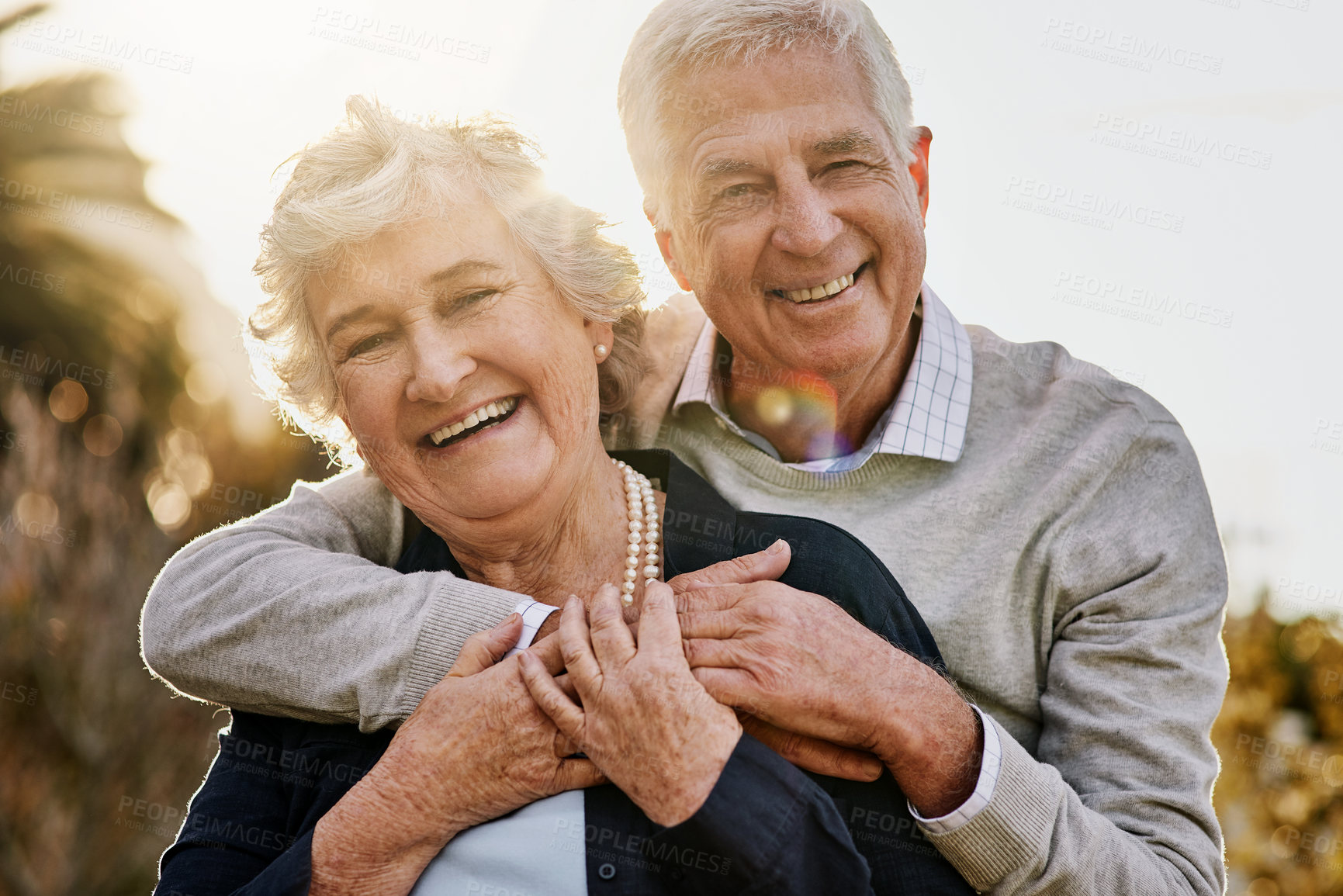 Buy stock photo Hug, nature and portrait of senior couple enjoying bonding, faces and relax in morning. Love, retirement and elderly man and woman smile outdoors for marriage, trust and happiness at sunrise