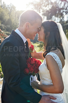 Buy stock photo Cropped shot of a bride and groom standing outside on their wedding day