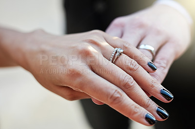 Buy stock photo Cropped shot of a newlywed couple wearing their wedding rings