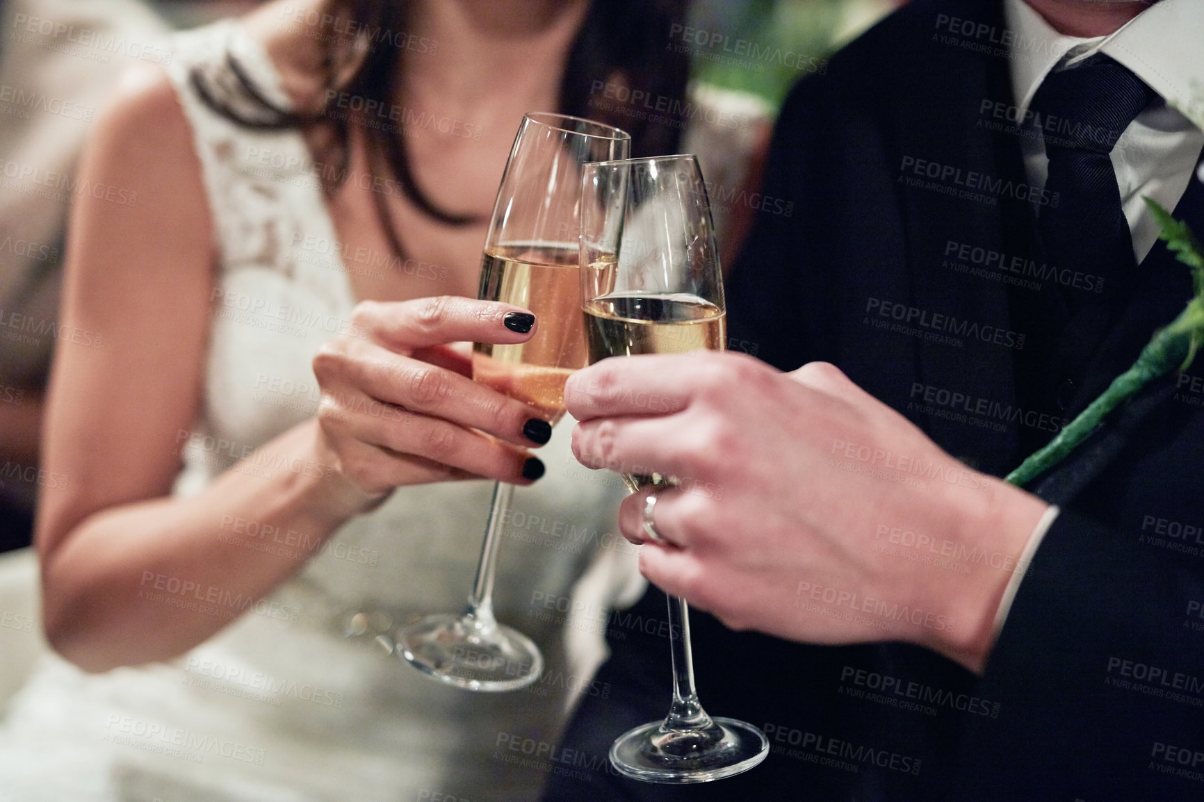 Buy stock photo Cropped shot of a newlywed couple toasting with wine on their wedding day