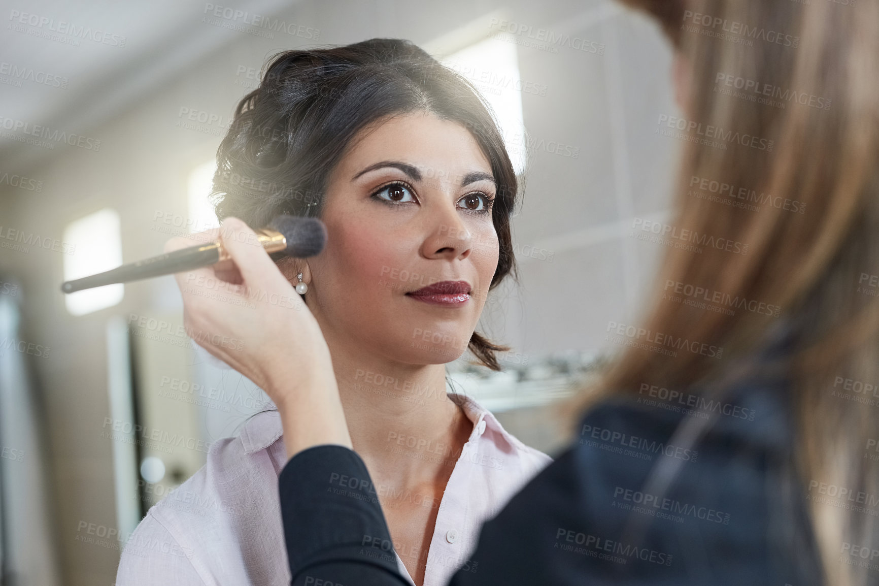 Buy stock photo Shot of a beautiful bride having her makeup done by her makeup artist