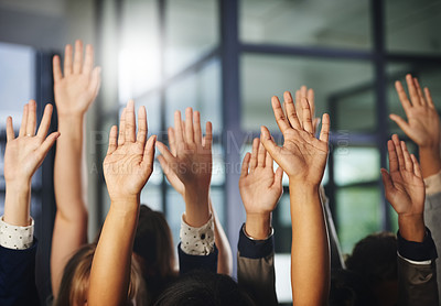 Buy stock photo Cropped shot of a group of unrecognisable businesspeople with their hands raised