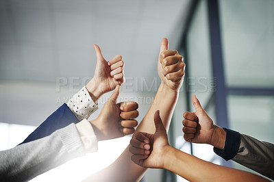 Buy stock photo Cropped shot of a group of unrecognisable businesspeople showing thumbs up