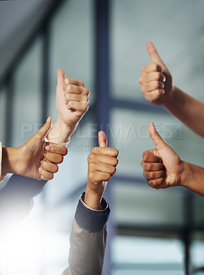 Buy stock photo Cropped shot of a group of unrecognisable businesspeople showing thumbs up
