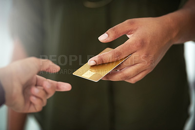 Buy stock photo Cropped shot of an unrecognisable person handing over a credit card for payment