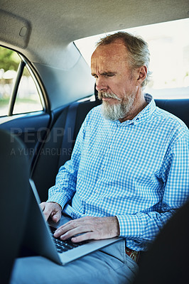 Buy stock photo Senior man, typing and laptop in car backseat for work, travel with tech for sales company. Male person, computer and admin tasks in transport with internet, search on database with commitment