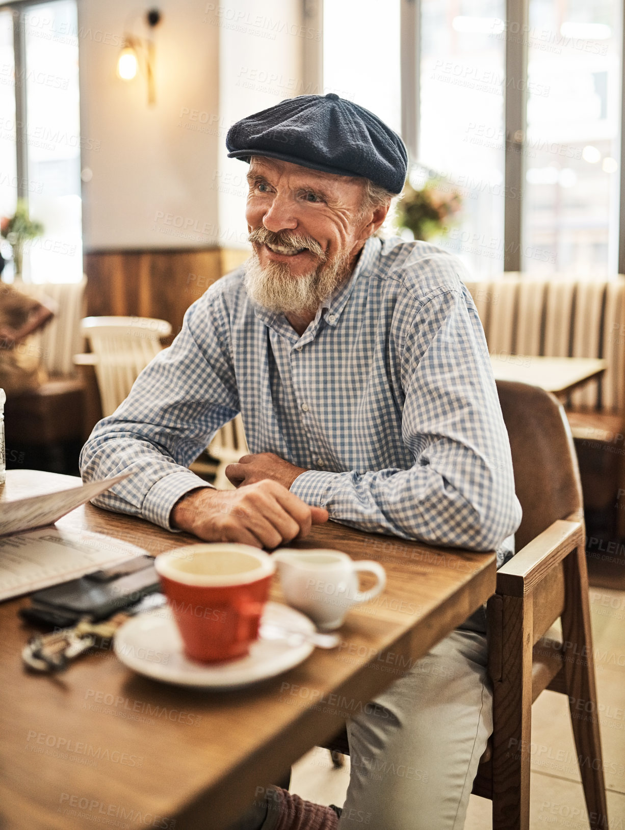 Buy stock photo Coffee shop, retirement and smile with senior man at table for conversation, hospitality or relax. Cafe, drink and service with happy elderly person in restaurant for morning or weekend time off