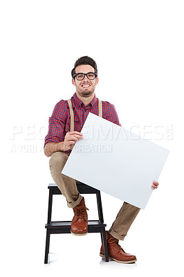 Buy stock photo Man, studio portrait and paper board for marketing, branding mockup and vote by white background. Young model, isolated and sitting with mock up poster, holding billboard and space for advertising
