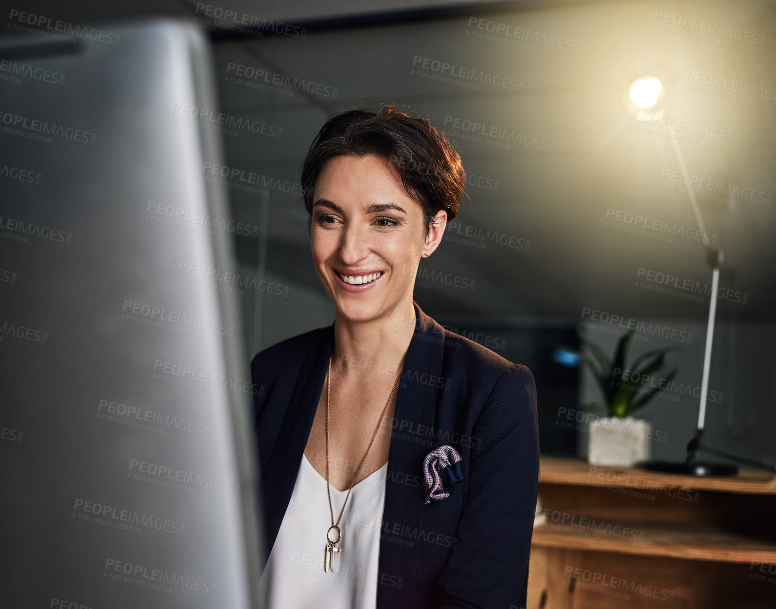 Buy stock photo Shot of a businesswoman working late on a computer in an office