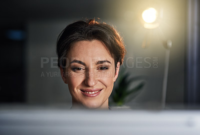 Buy stock photo Shot of a businesswoman working late on a computer in an office