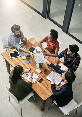 Buy stock photo High angle shot of a group of colleagues having a meeting in a modern office