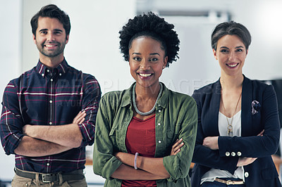 Buy stock photo Portrait of a group of businesspeople standing with their arms folded in a modern office