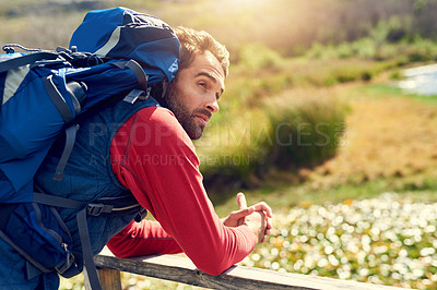 Buy stock photo Hiking, nature and man with backpack relax for adventure, trekking and journey in countryside. Travel, fitness and happy person outdoors walking by lake for wellness, fresh air or exercise on weekend