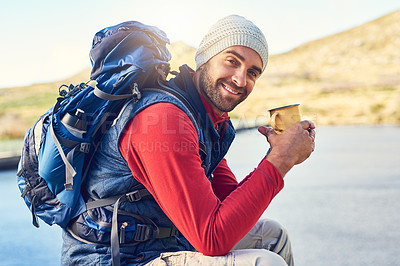 Buy stock photo Portrait of a happy hiker drinking coffee while admiring a lake view on a trail