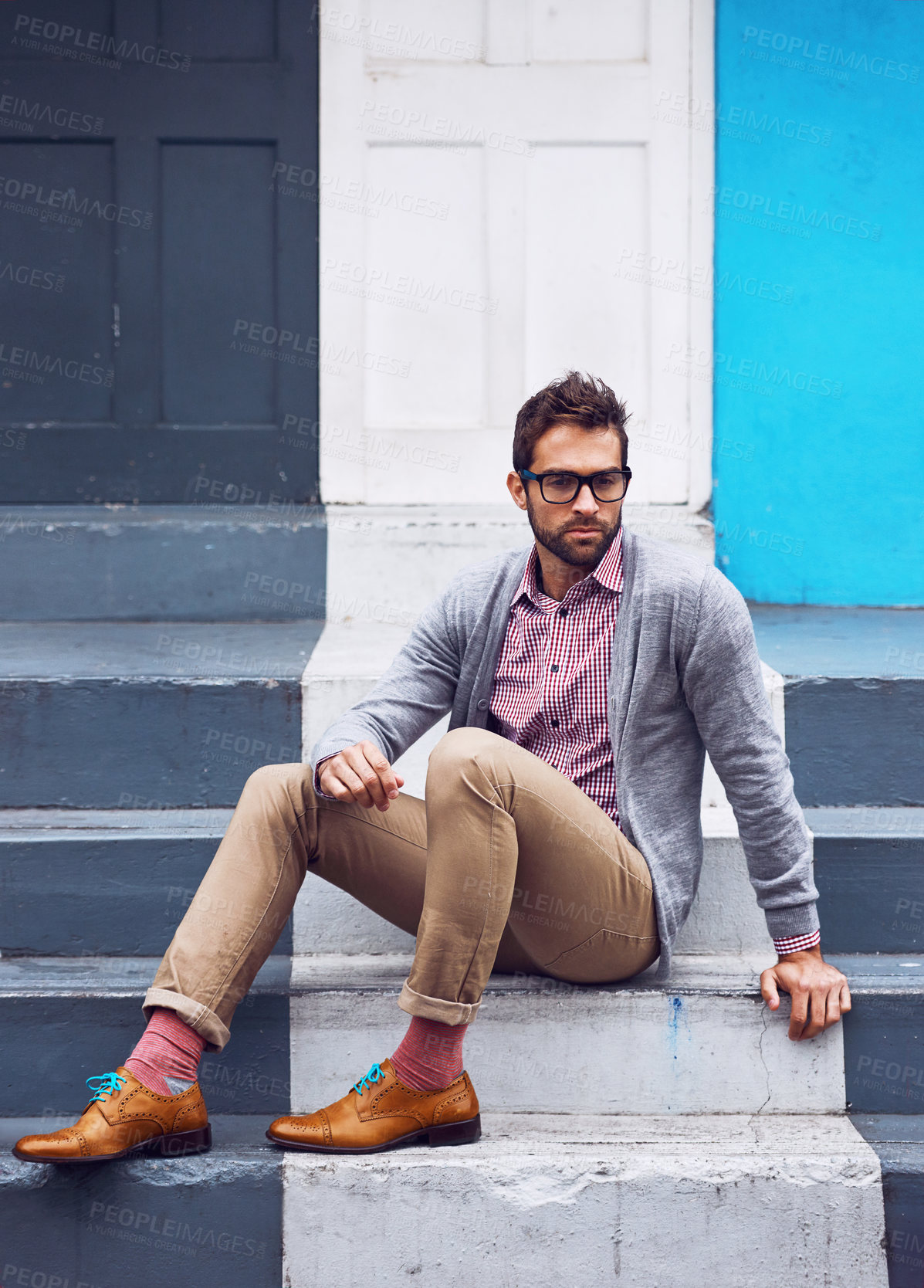 Buy stock photo Serious, fashion and man on stairs in city with stylish, elegant and trendy outfit with confidence. Pride, glasses and person with classy cardigan, shirt and shoes for style by steps in urban town.