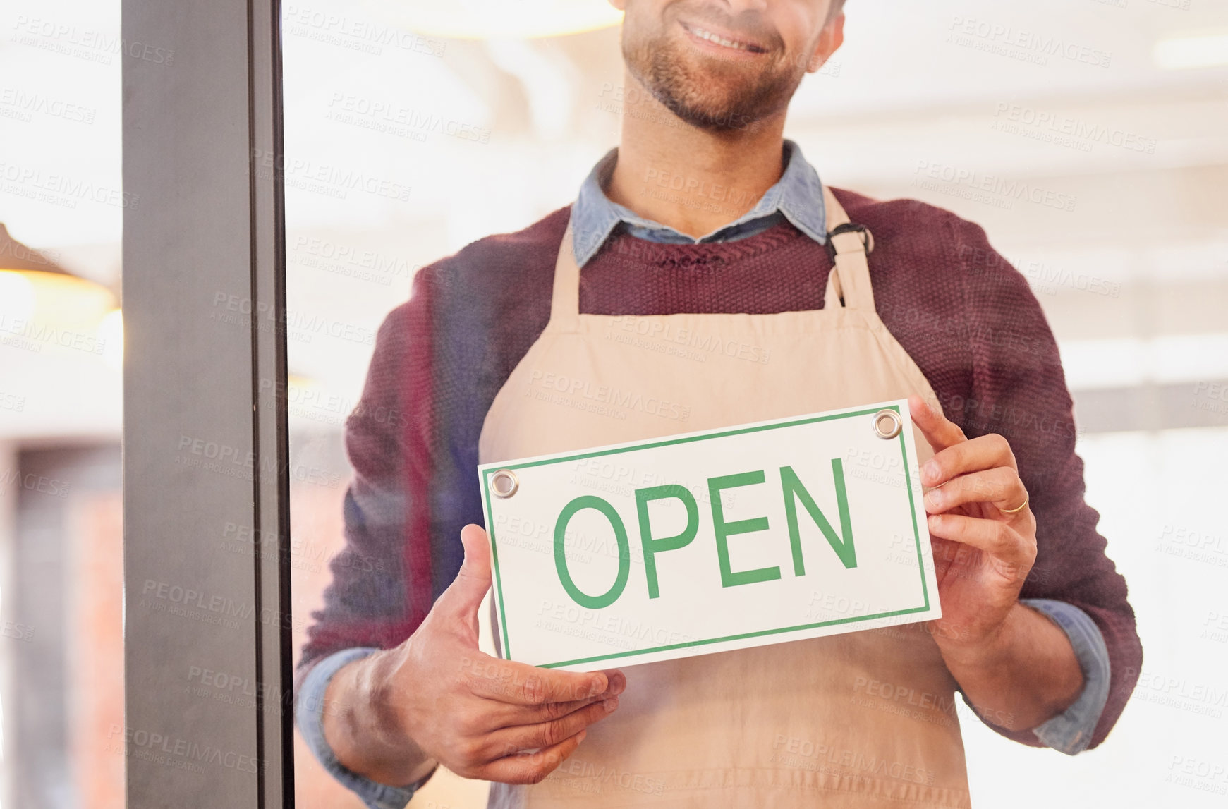 Buy stock photo Business, hands and open sign by man at cafe door for welcome, customer service or startup success. Hospitality, industry and male waiter with poster for announcement, message or entrance greeting