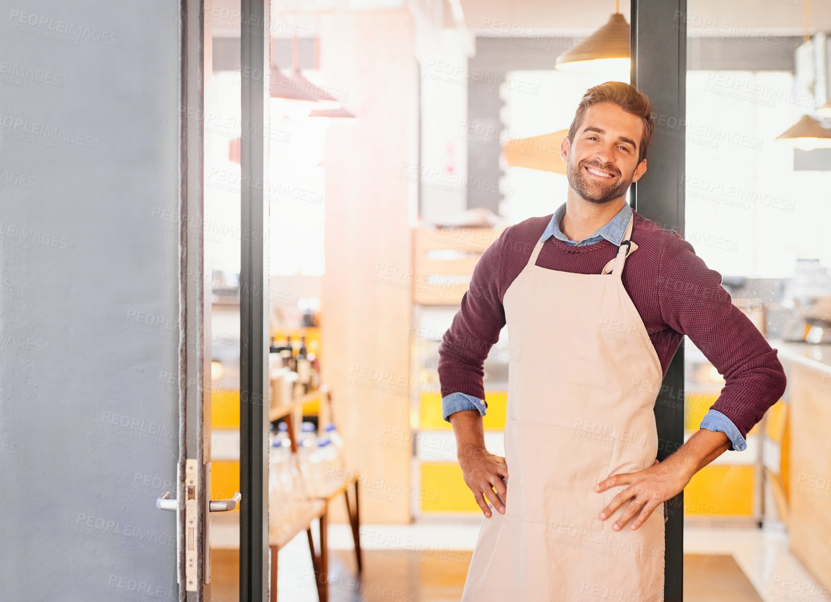 Buy stock photo Happy man, portrait and cafe with door for small business, welcome or startup at indoor restaurant. Creative male person, businessman or waiter with smile, apron or ready for service at coffee shop