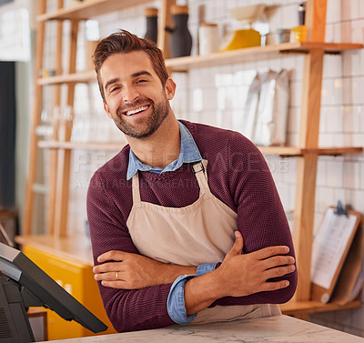 Buy stock photo Portrait of a happy business owner posing behind the counter in his coffee shop