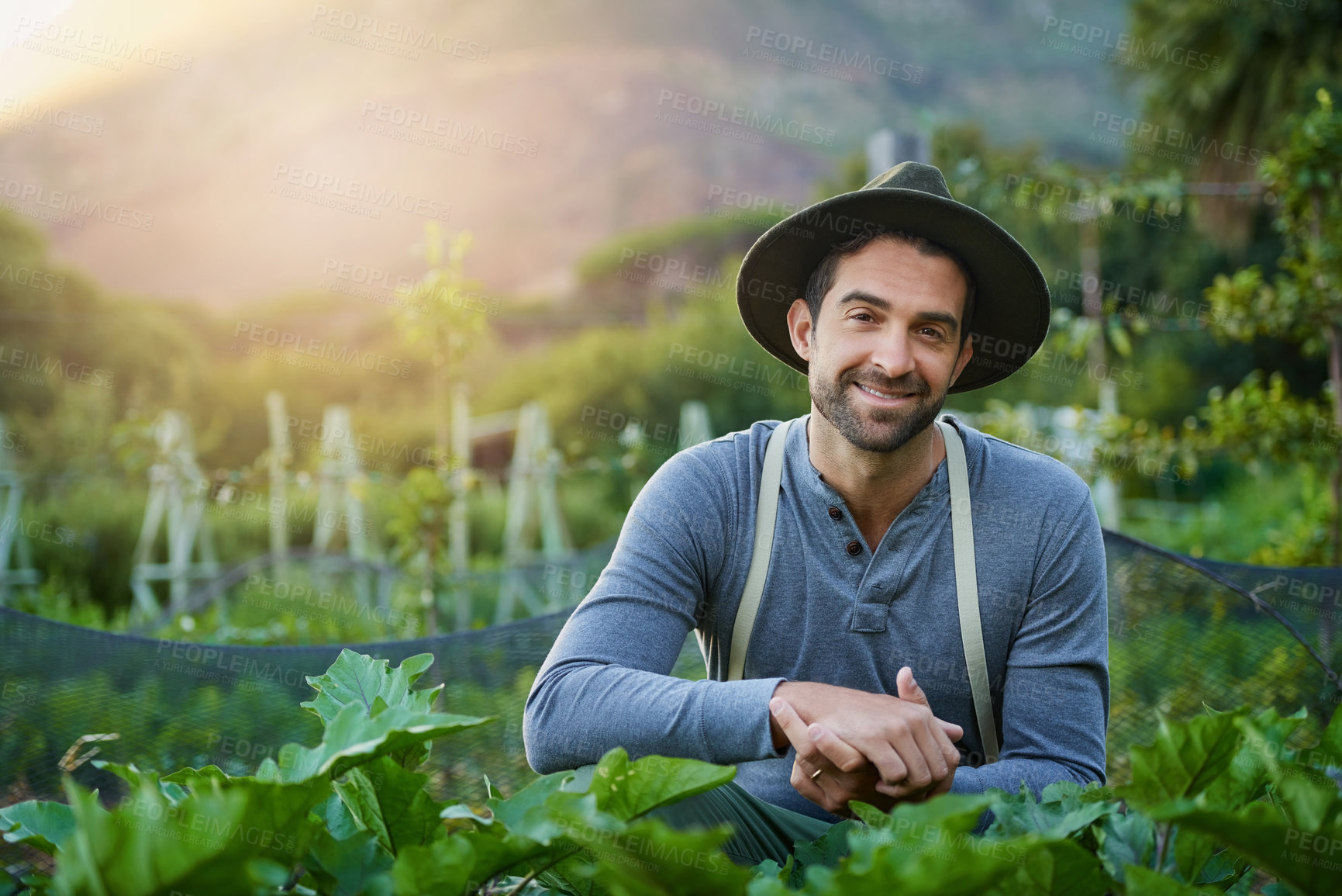 Buy stock photo Portrait of a young man tending to the crops on a farm
