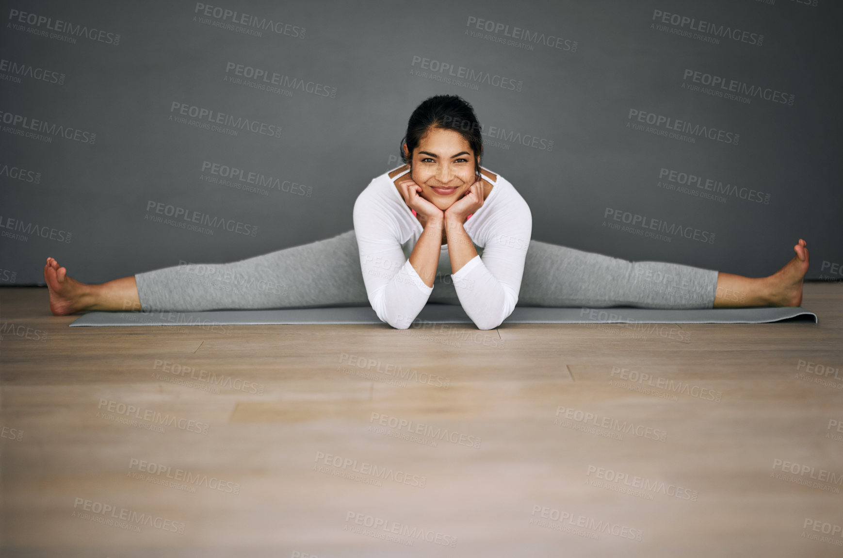 Buy stock photo Woman, yoga and home portrait in splits, pilates and wall background for body wellness with relaxing smile. Happy, flexibility training and stretching legs on mat, contortion and balance activity