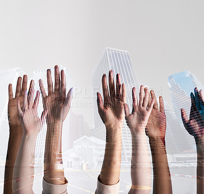 Buy stock photo Shot of a city superimposed over an unidentifiable business team putting their hands up together