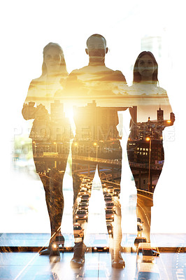Buy stock photo Shot of a city superimposed over a portrait of three ambitious businesspeople posing in the office