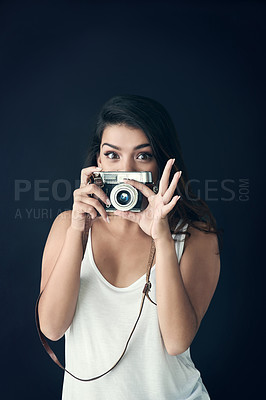 Buy stock photo Photographer, woman and studio for creative person, photography for memories on dark background. Face, vintage equipment and photo journalist or paparazzi, photoshoot and professional with camera