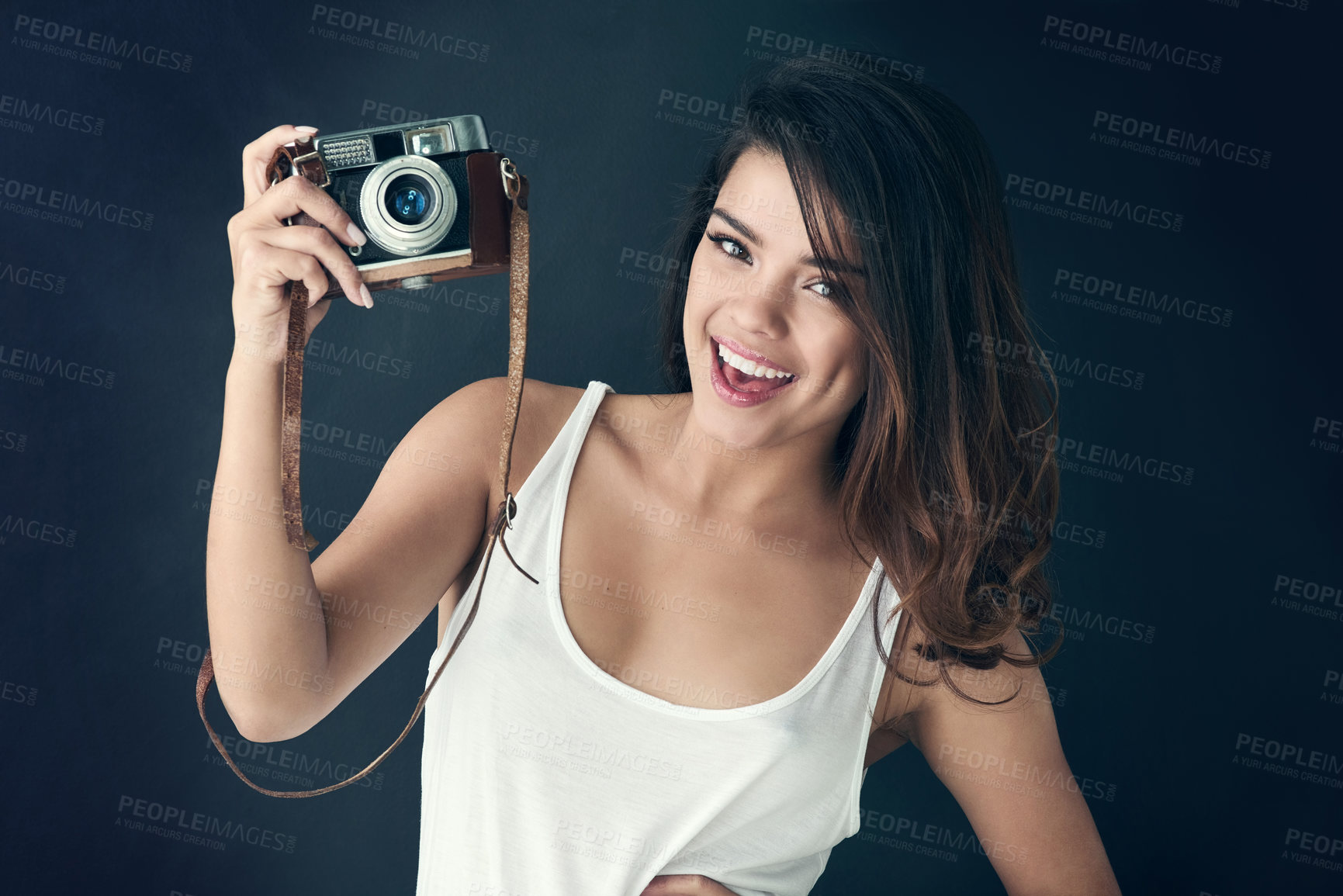 Buy stock photo Photographer, woman and studio for creative person, photography for memories on blue background. Portrait, vintage equipment and photo journalist or paparazzi, smile and professional with camera 