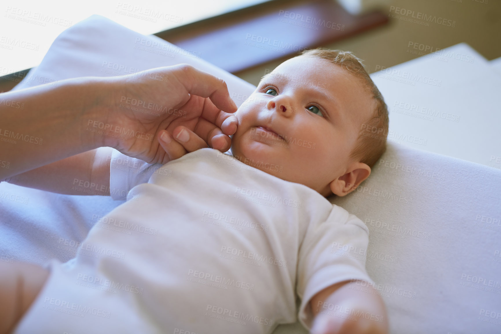 Buy stock photo Hand, parent and baby in home for care or bonding with trust, love and child development. People, family and toddler or kid as newborn with support, relax and playful for growth and wellness