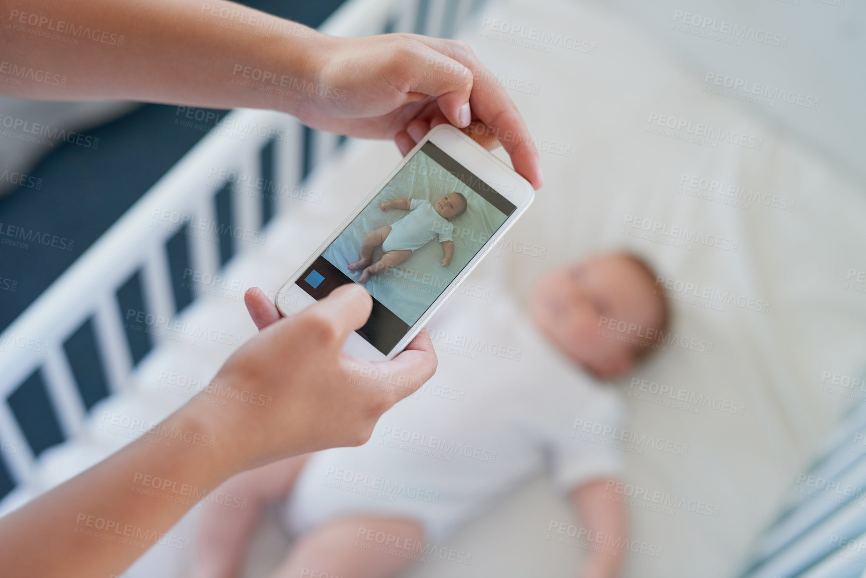 Buy stock photo Phone screen, hands and person with picture of baby for digital memory, photo album and love in home. Parent, mobile and photography for newborn child with social media, video call or online post