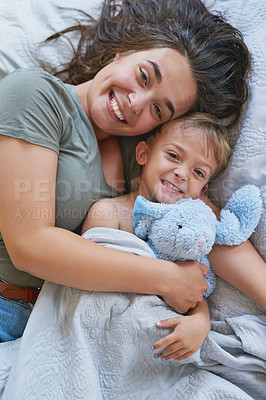 Buy stock photo Shot of a young woman bonding with her son at home