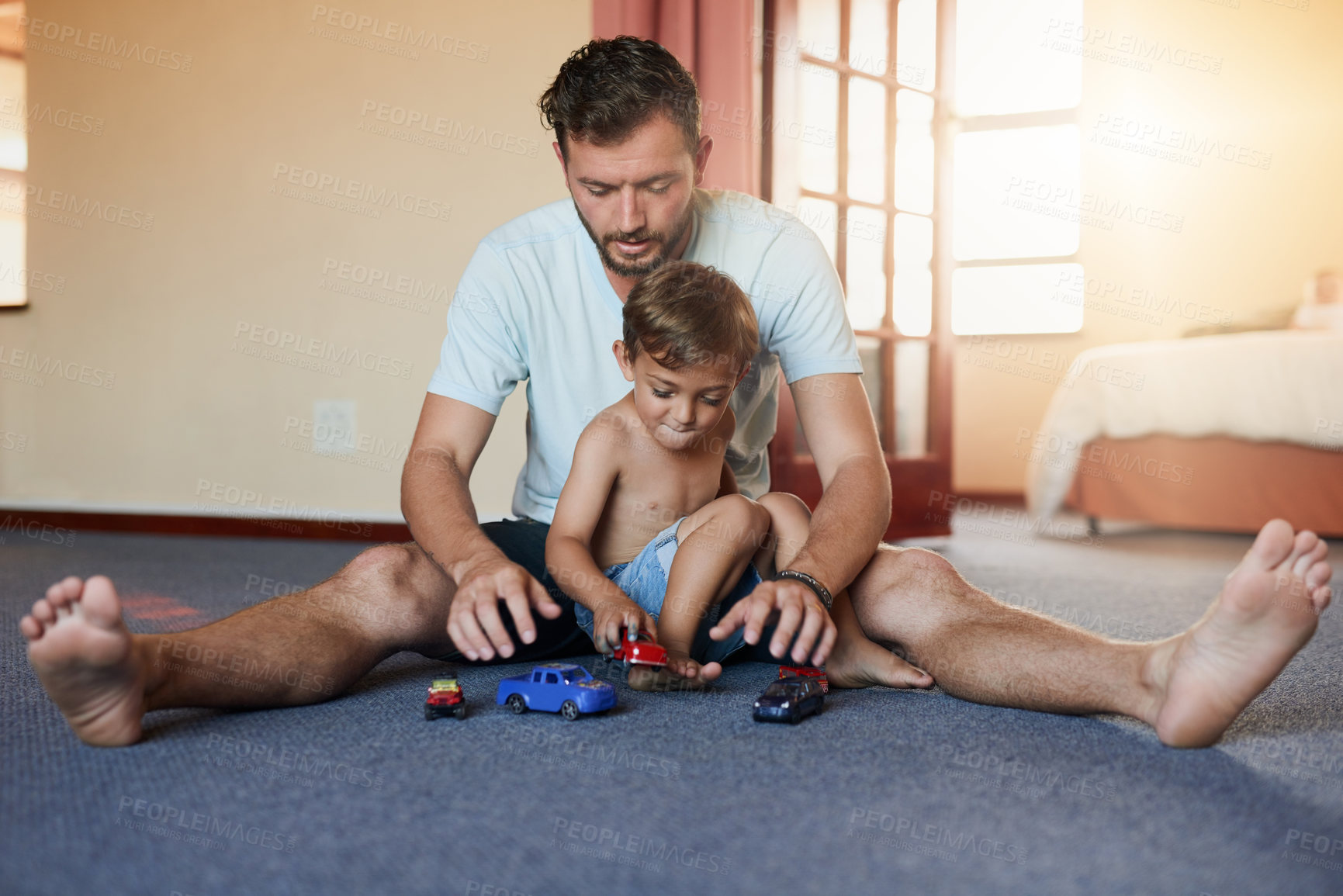 Buy stock photo Dad, boy child and playing with car on floor for healthy growth, trust and game in home. Father, young son and transport toys for fun on carpet with bonding together, love support and development