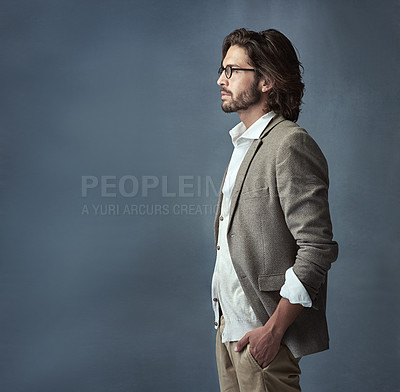 Buy stock photo Cropped studio shot of a handsome and stylish young man against a grey background