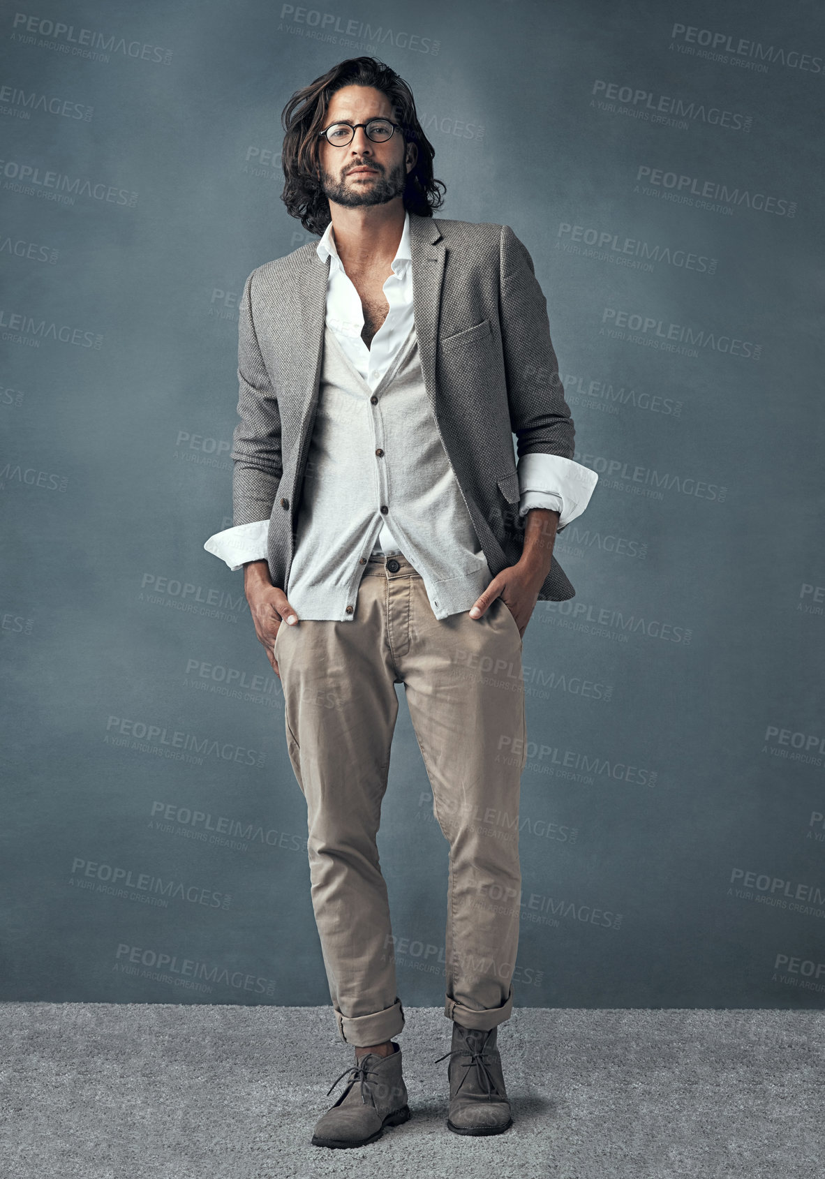 Buy stock photo Full length studio portrait of a handsome and stylish young man against a grey background