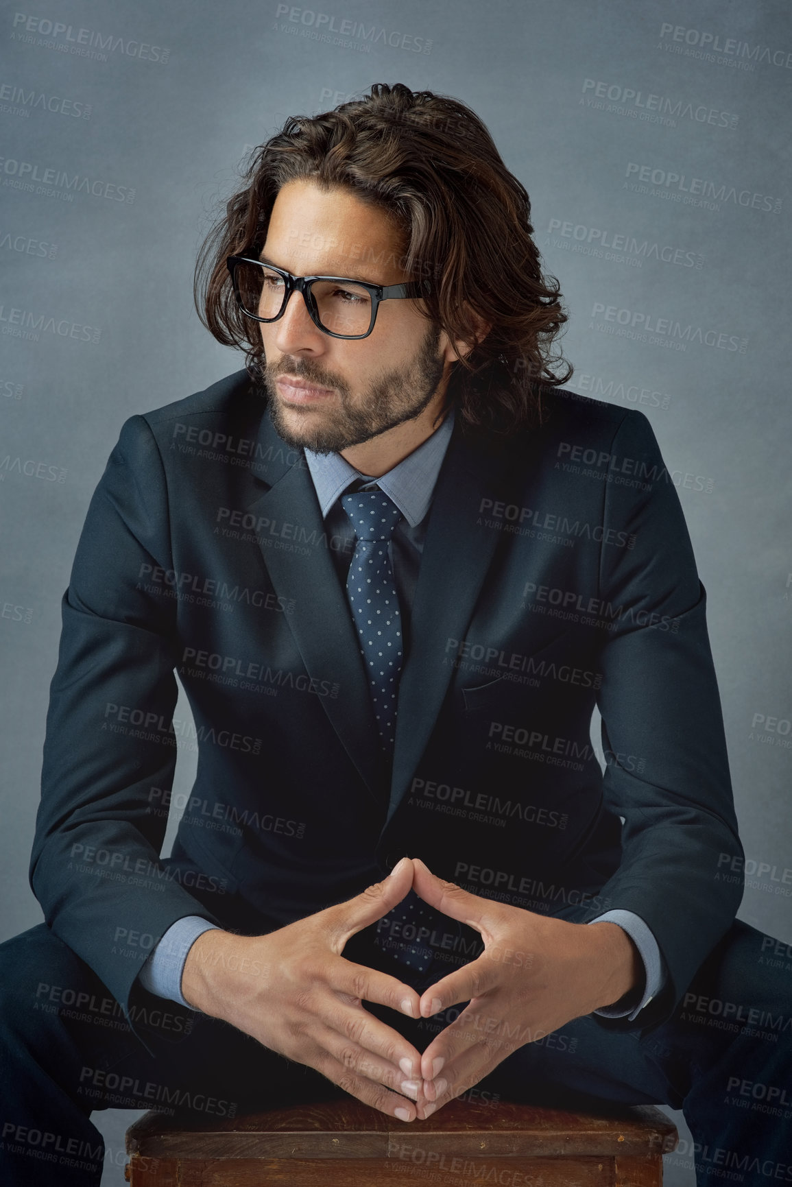 Buy stock photo Studio shot of a well-dressed businessman against a grey background