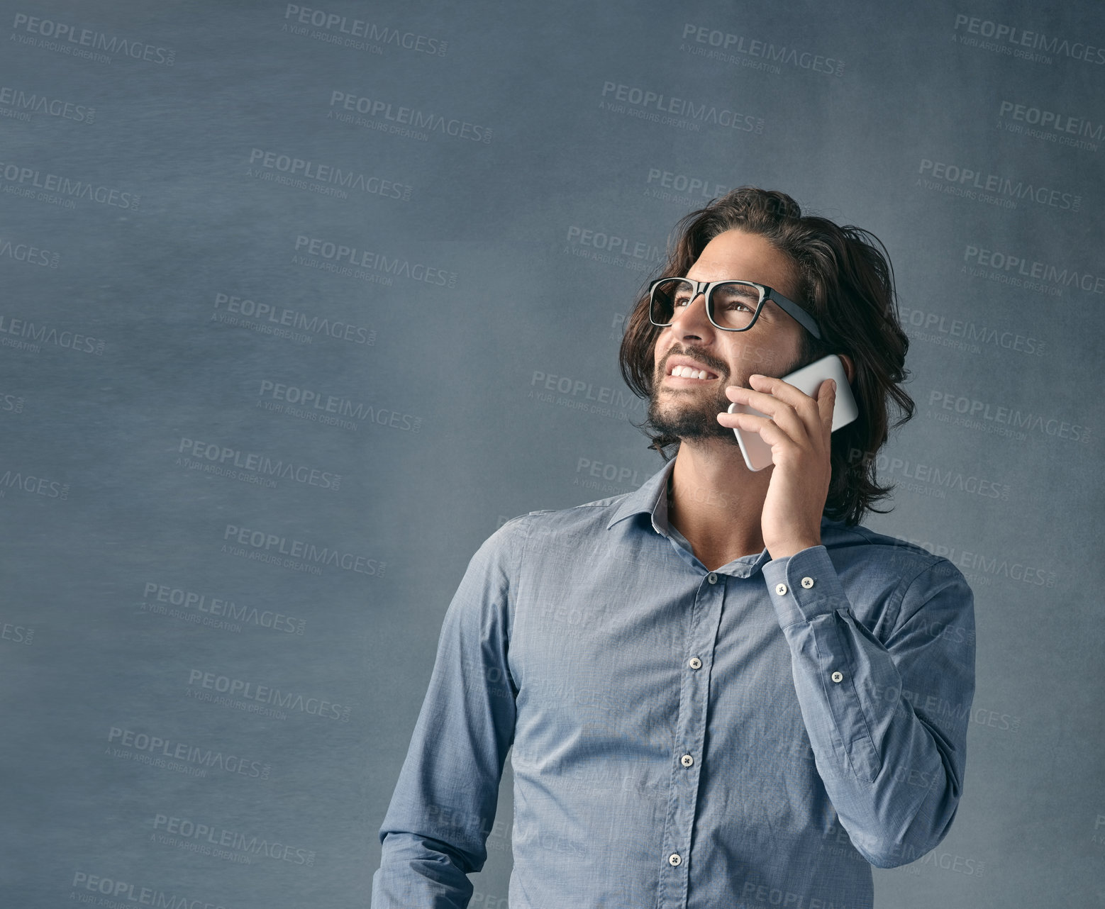 Buy stock photo Businessman, thinking and talking with phone call for decision or communication on a gray studio background. Young male person or employee listening in mockup on mobile smartphone for business chat