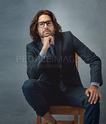 Buy stock photo Studio shot of a well-dressed businessman against a grey background