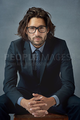 Buy stock photo Studio shot of a well-dressed businessman against a grey background