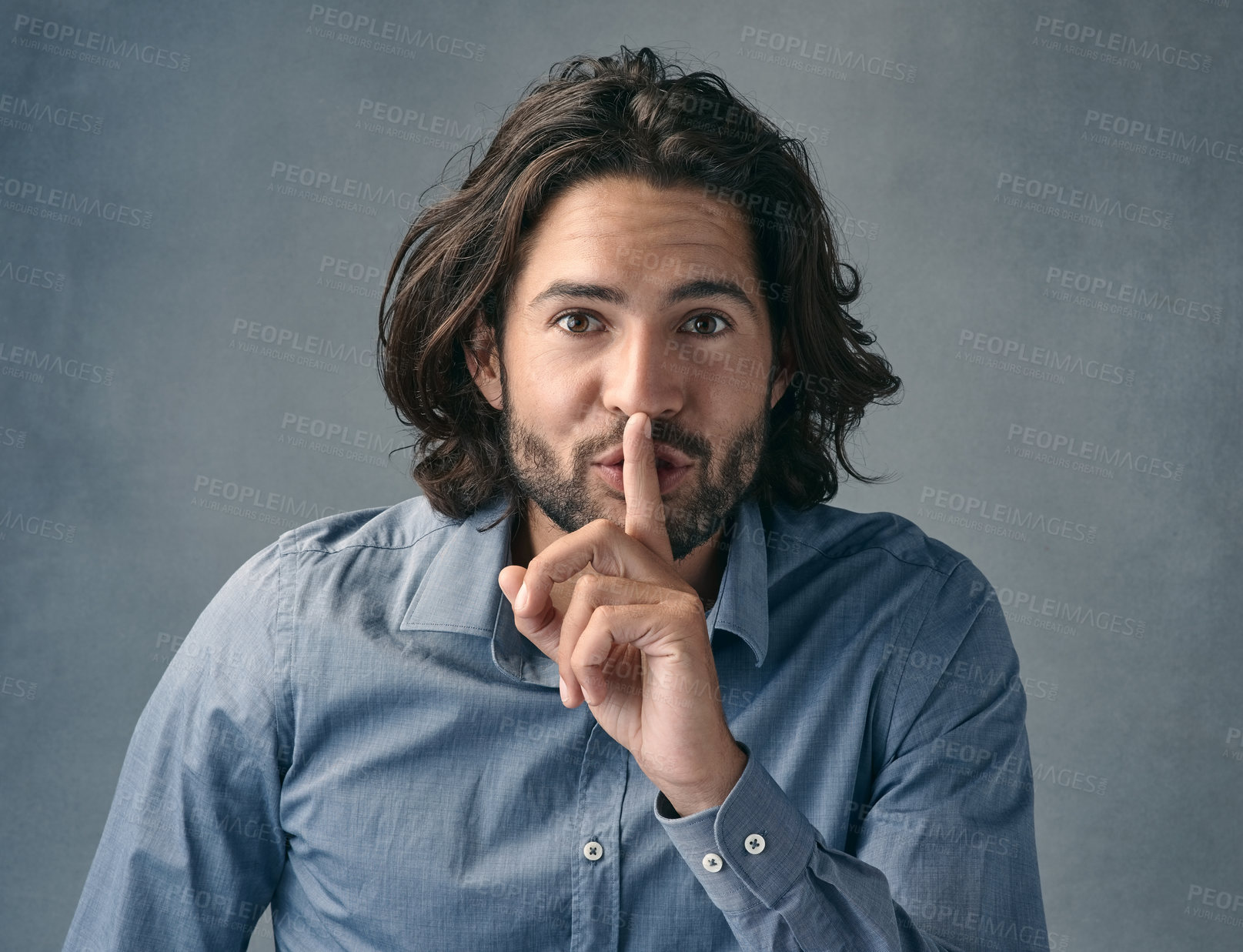 Buy stock photo Businessman, portrait and finger on lips with studio backdrop for secret, sensitive information and professional privacy. Employee, hand gesture and quiet on gray background for secure communication.