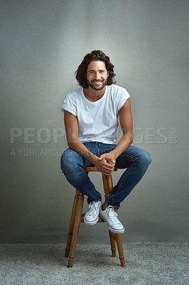 Buy stock photo Studio portrait of a handsome young man posing against a grey background