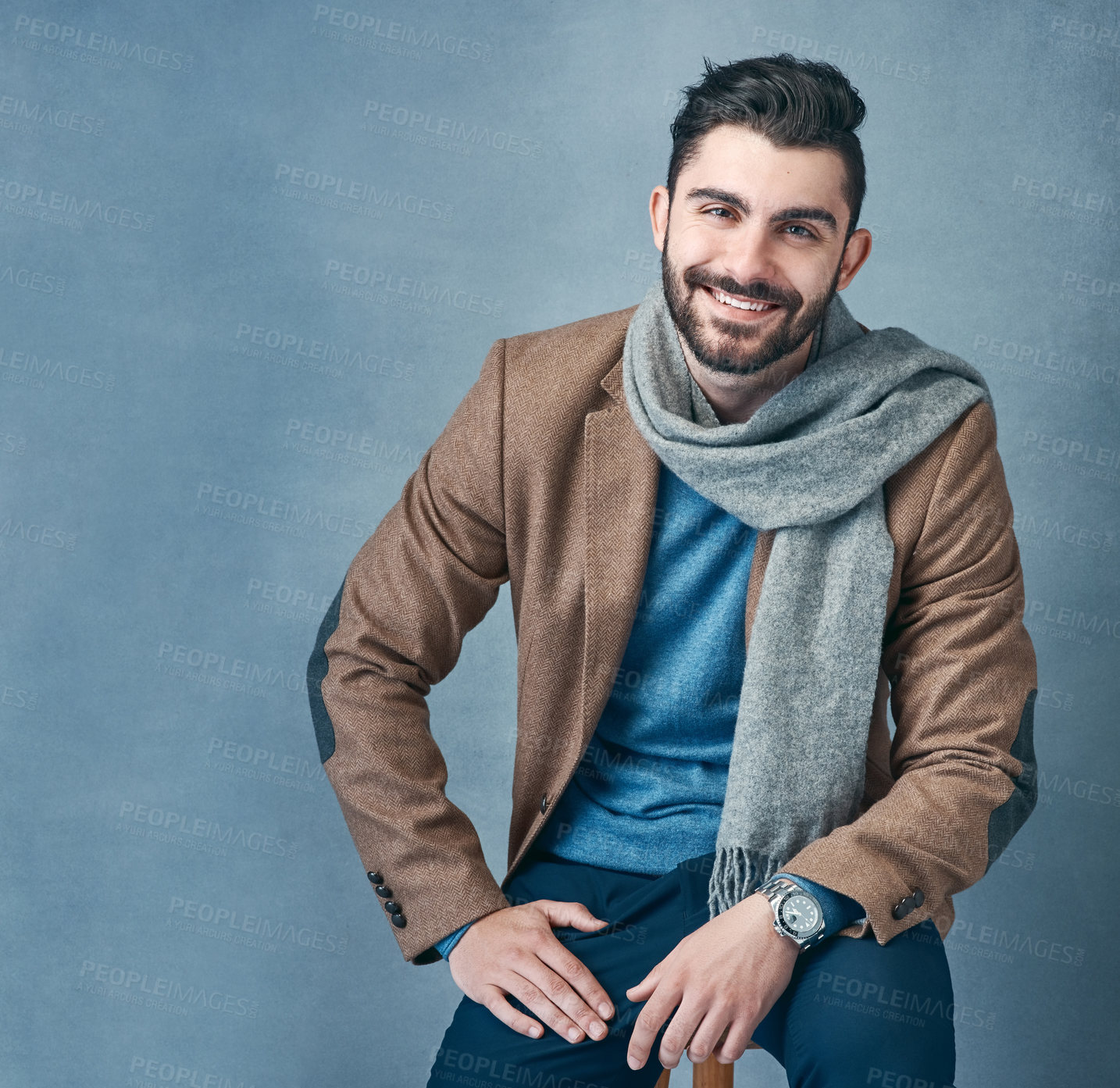 Buy stock photo Business man, scarf and smile in studio portrait with fashion, confidence or mockup space by background. Person, happy and suit on chair, pride and winter clothes for job at creative agency in Turkey