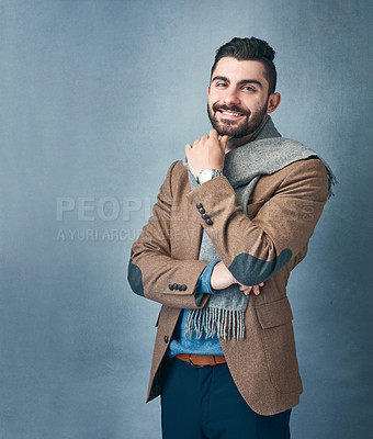 Buy stock photo Studio shot of a stylishly dressed young man posing against a grey background