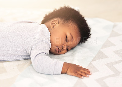 Buy stock photo Baby, african boy and sleeping on bed for rest, health and peace for growth, development and relax in family home. Black male infant, tired and sleep in bedroom with fatigue, quiet and calm in house