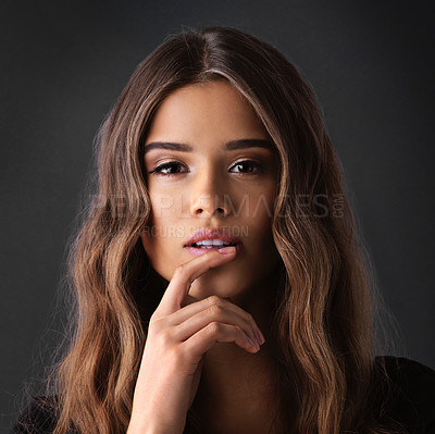 Buy stock photo Attractive woman, portrait and beauty with makeup for cosmetics or hair care in confidence or studio on a dark background. Face of young female person, model or brunette with facial or wavy hairstyle