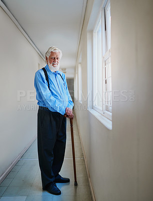 Buy stock photo Portrait of a happy senior man posing in the hallway of his nursing home