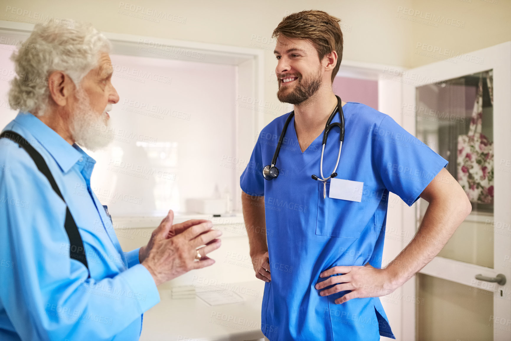 Buy stock photo Shot of a senior patient consulting with his doctor in the hospital